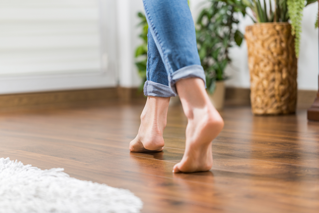 Warm floor - the concept of floor heating and wooden panels.
